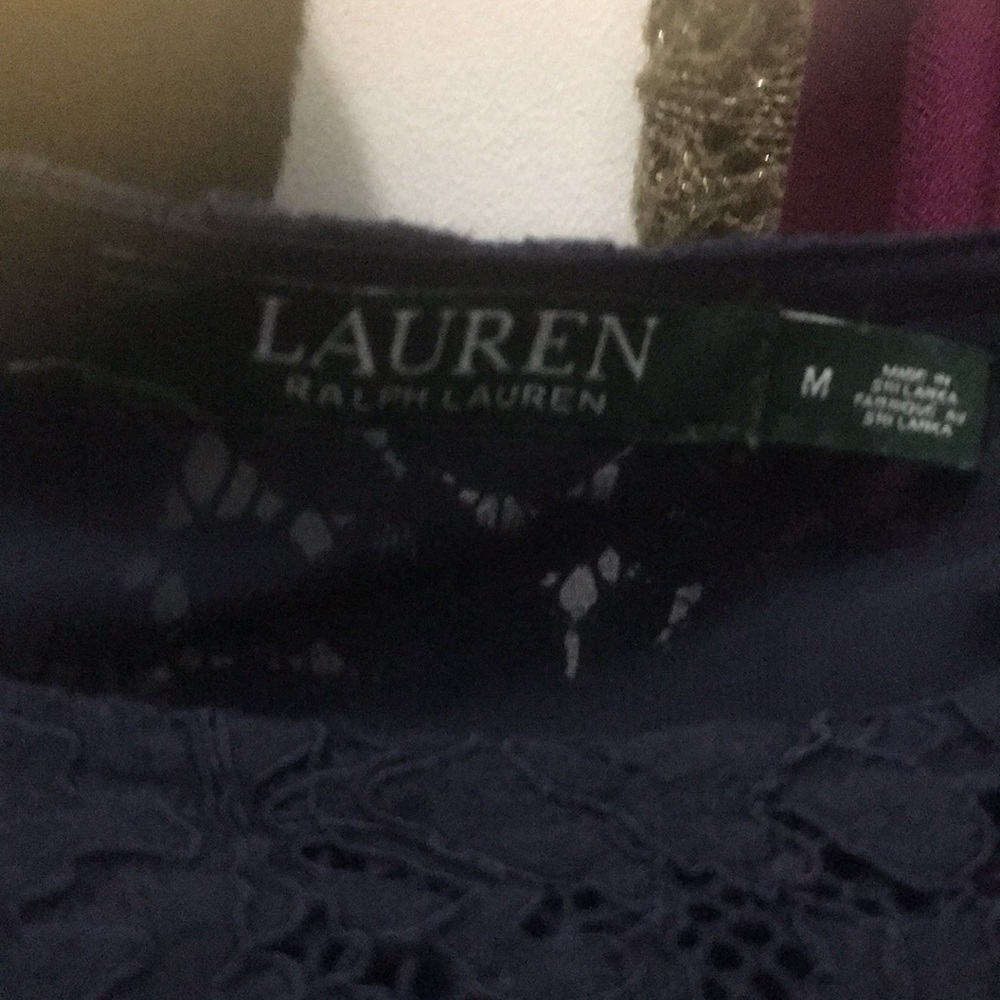 Navy blue blouse with bell sleeves.